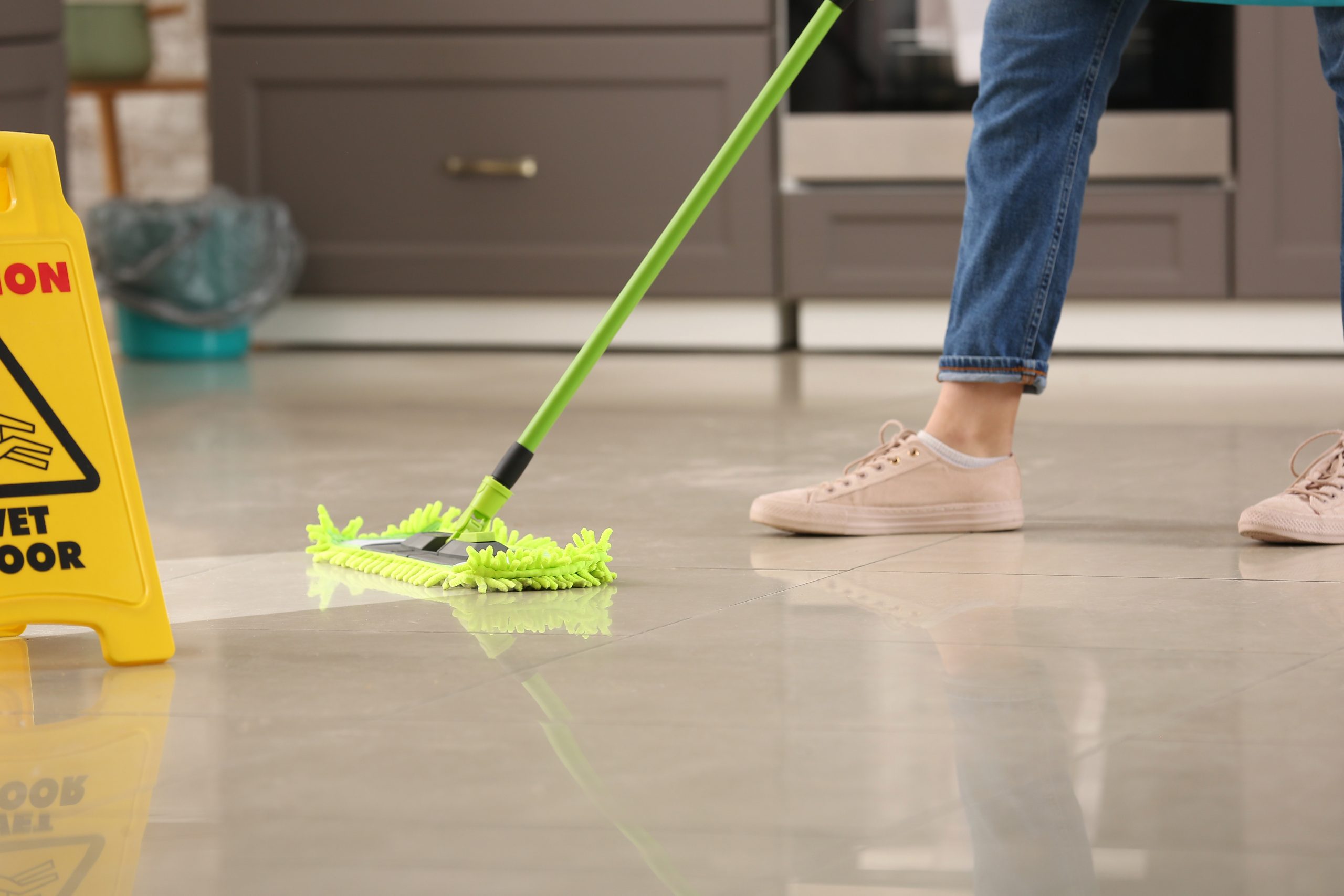 Female,Janitor,Mopping,Floor,In,Kitchen