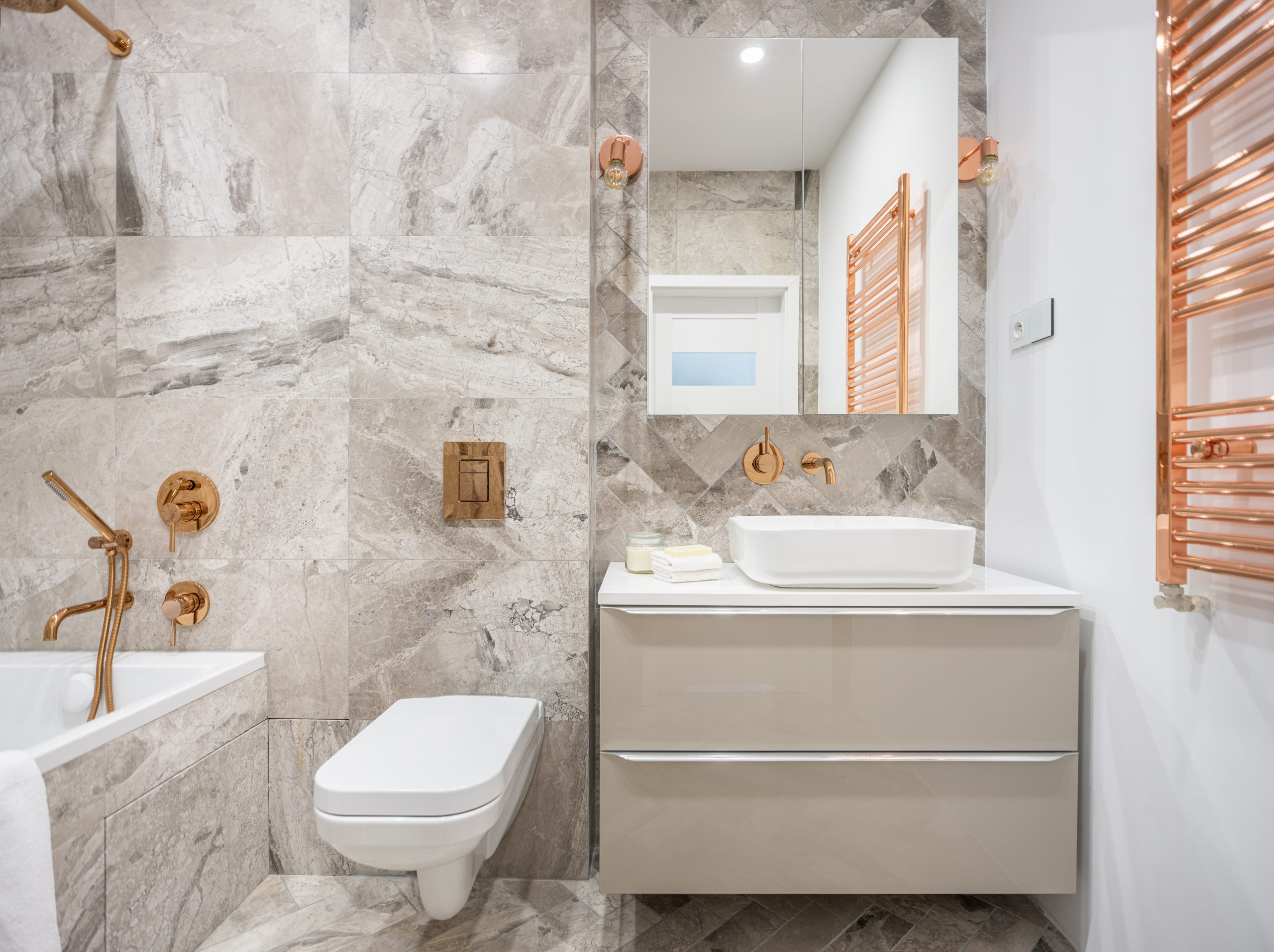 Beige,Bathroom,With,Marble,Style,Tiles,And,Golden,Taps,,Lamps